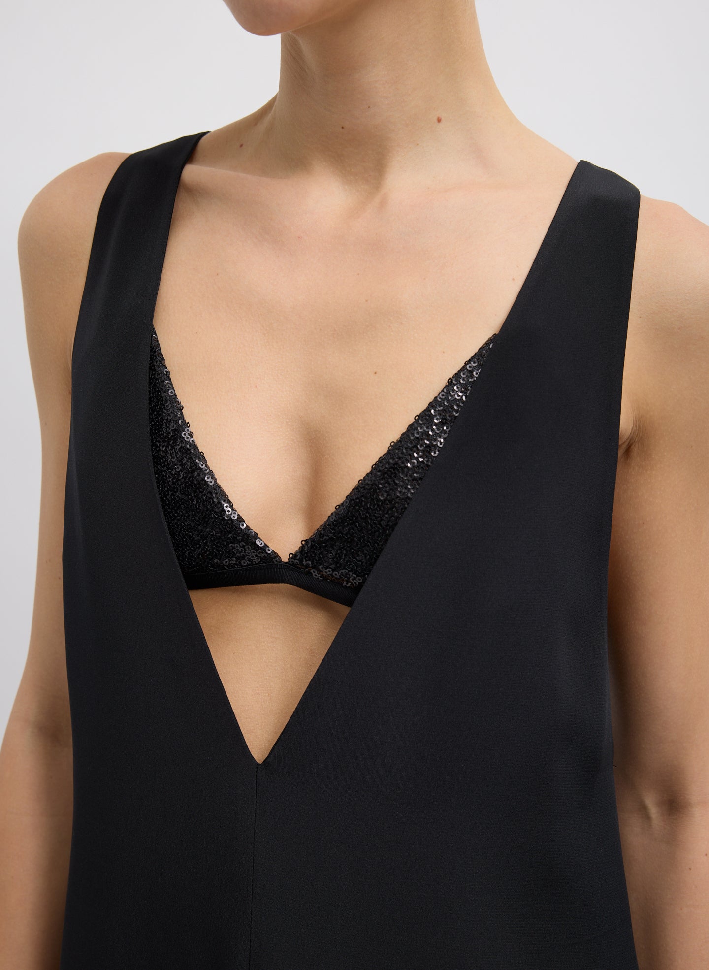 Black 4-Ply Silk V-Neck Dress With Bra - closeup of neckline and sequin built-in bra
