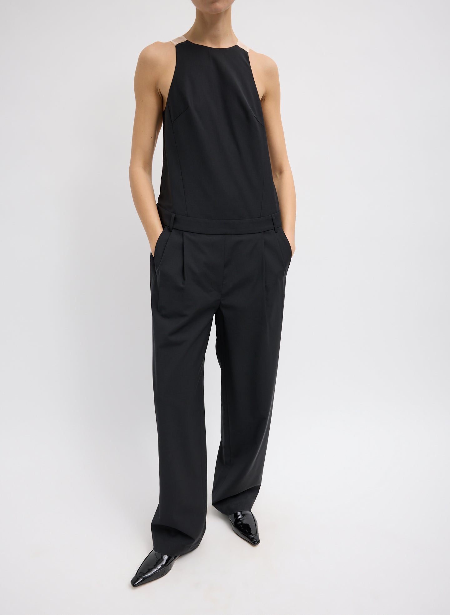 Recycled Tropical Wool Jumpsuit - Black Recycled Tropical Wool Jumpsuit - sheer organza back, front view on model