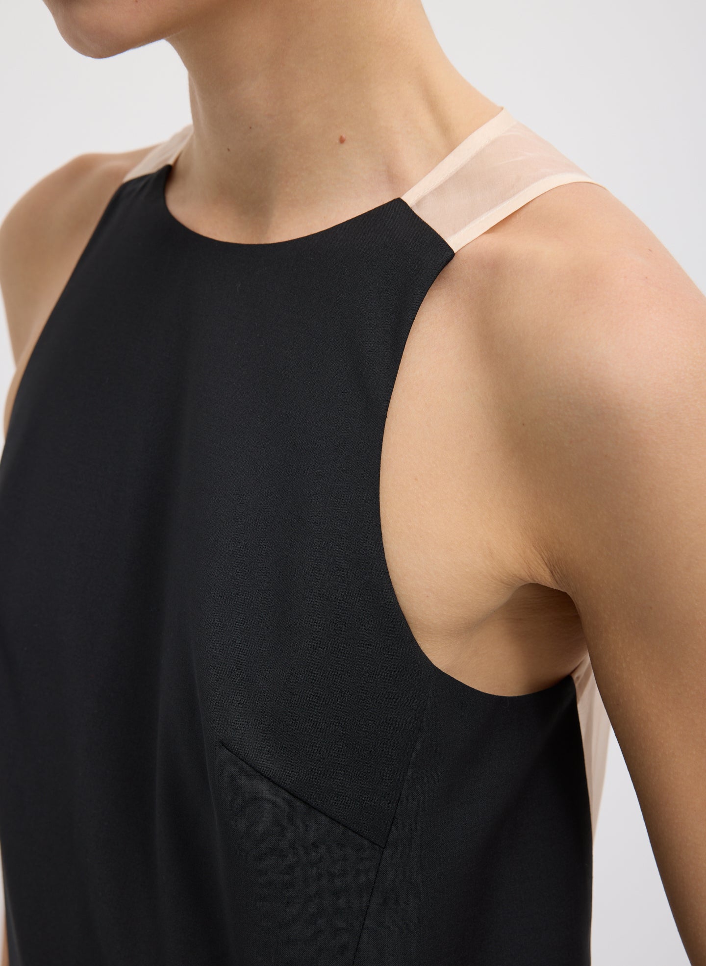 Black Recycled Tropical Wool Jumpsuit - closeup of front neckline and strap detail
