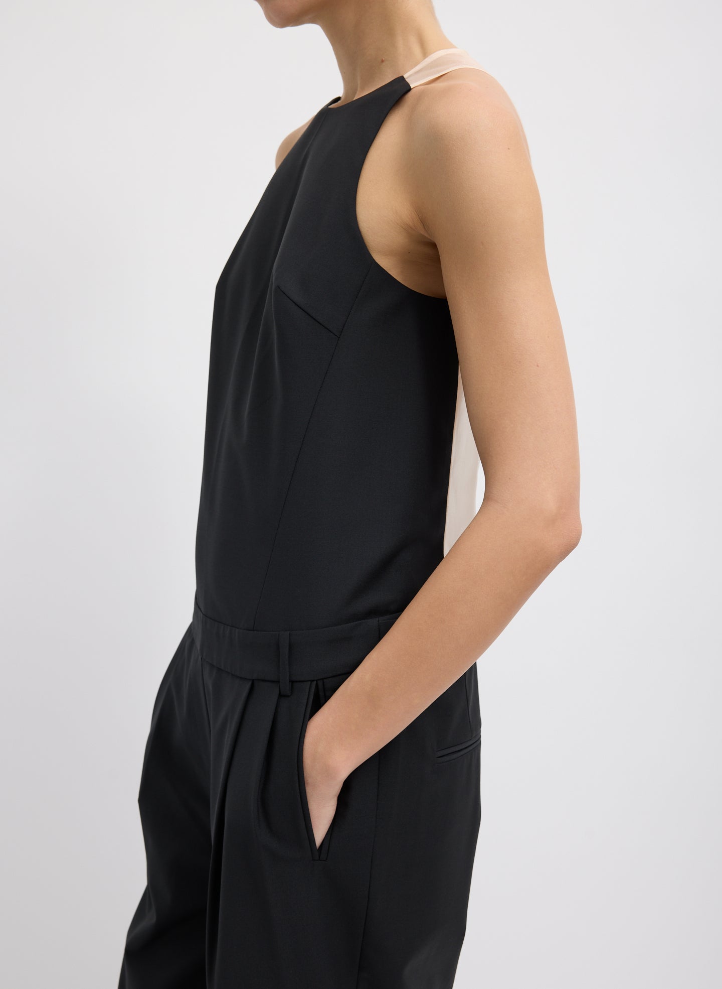 Black Recycled Tropical Wool Jumpsuit - closeup of side view on model