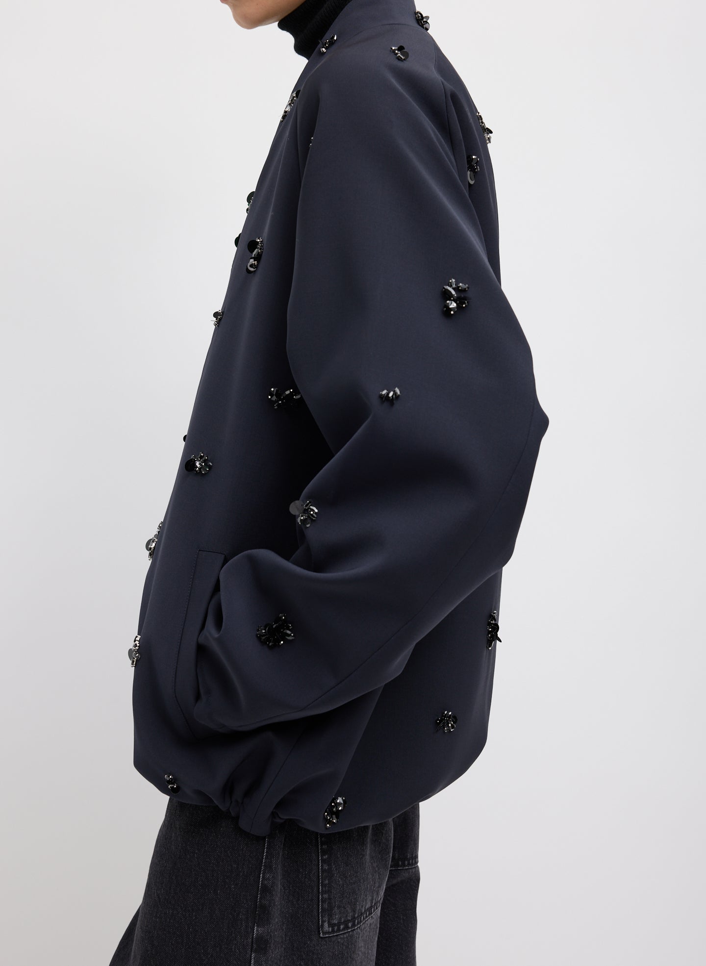 Black Tropical Wool Beaded Bomber Jacket - embellished, side view on model