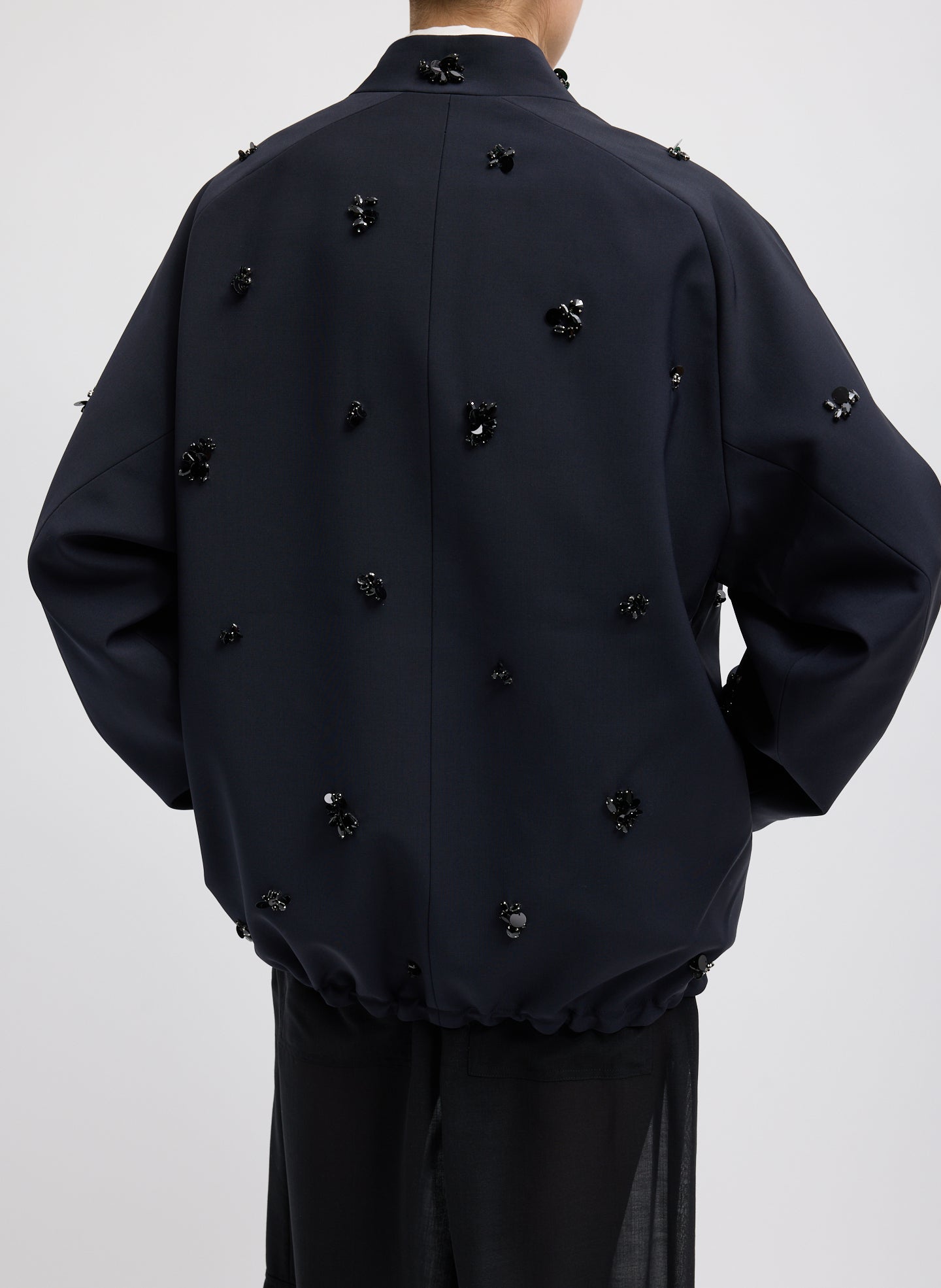 Black Tropical Wool Beaded Bomber Jacket - embellished, back view on model