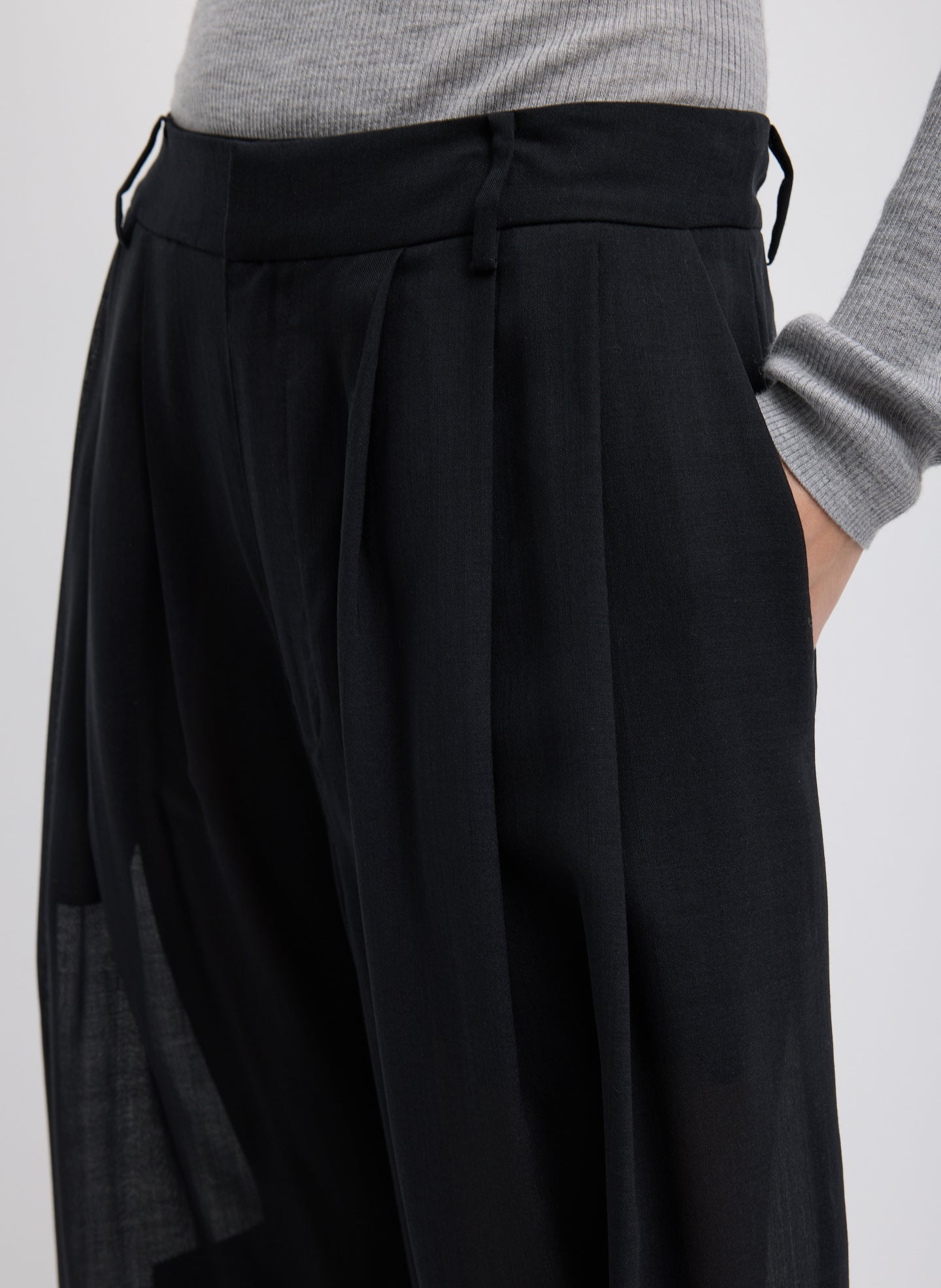 Black Sheer Wool Gauze Triple Pleat Pant – closeup of pockets 