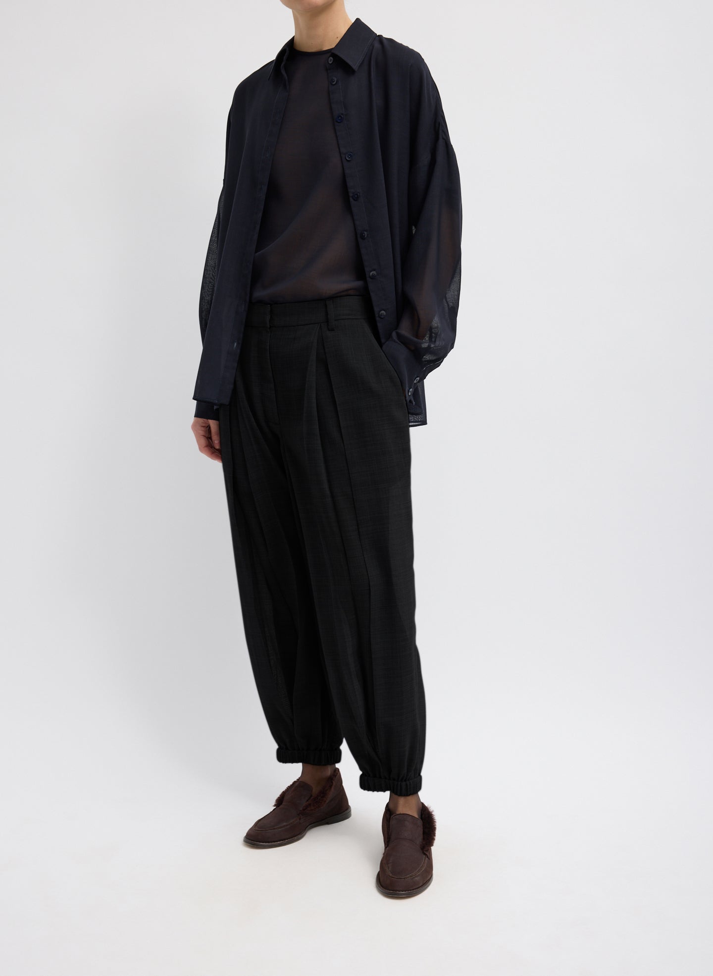 Black Sheer Wool Gauze Pleated Long Balloon Pant – relaxed fit, side view on model 