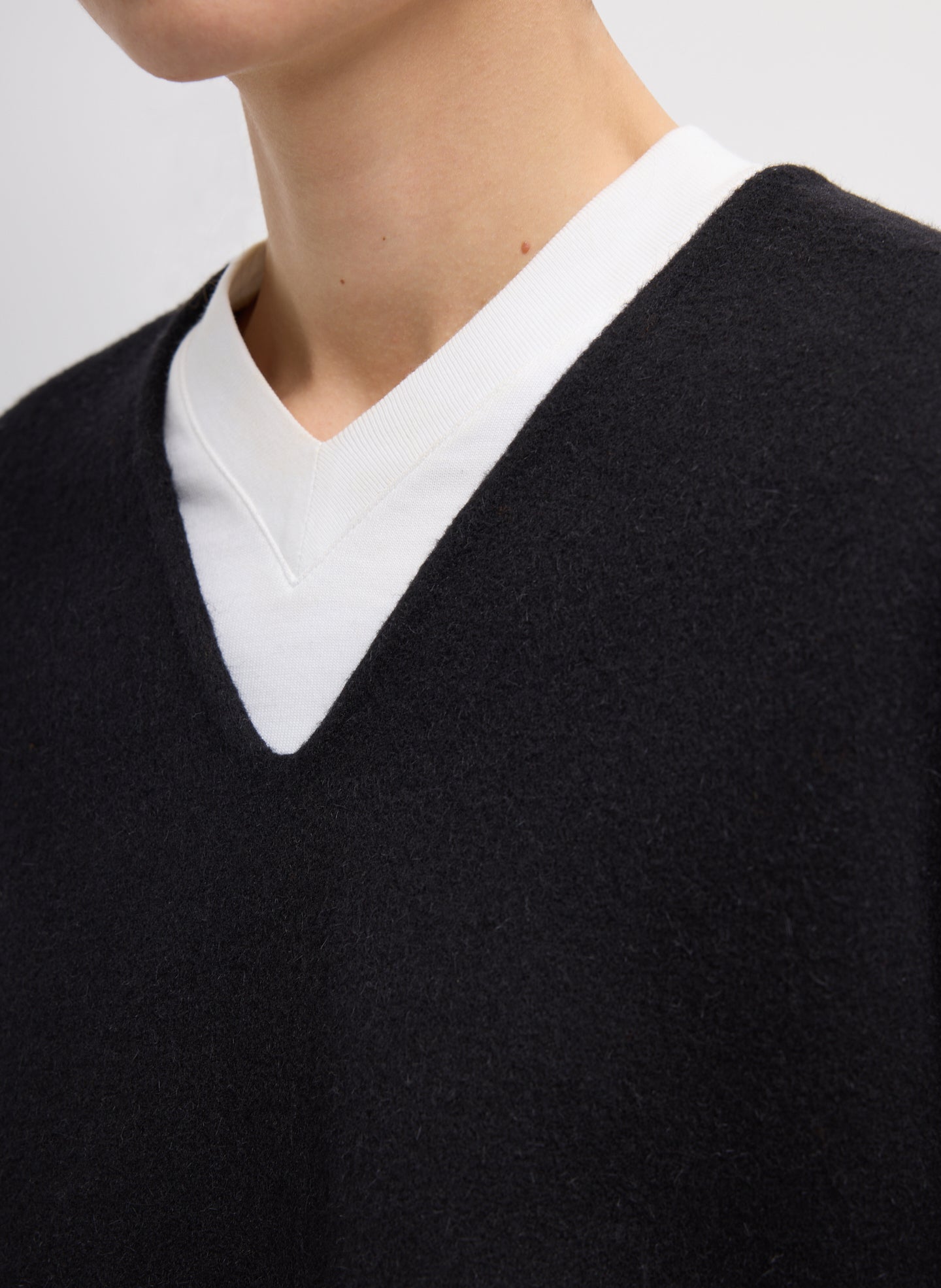 Black Luxe Double Faced Wool Angora V-Neck Top - Closeup of V-neck detail