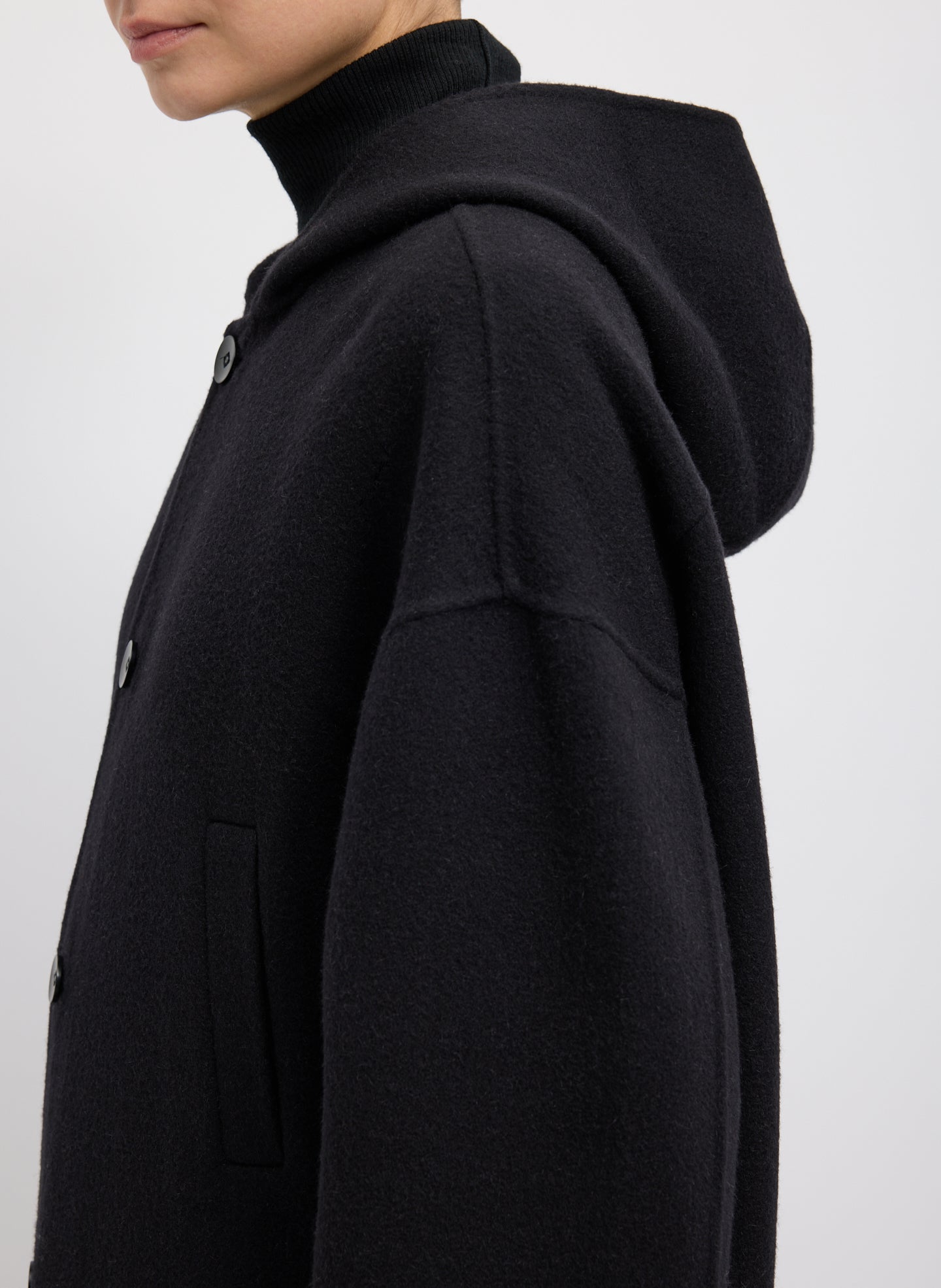Black Luxe Double Faced Wool Angora Hooded Coat – relaxed fit, closeup of shoulder detail 