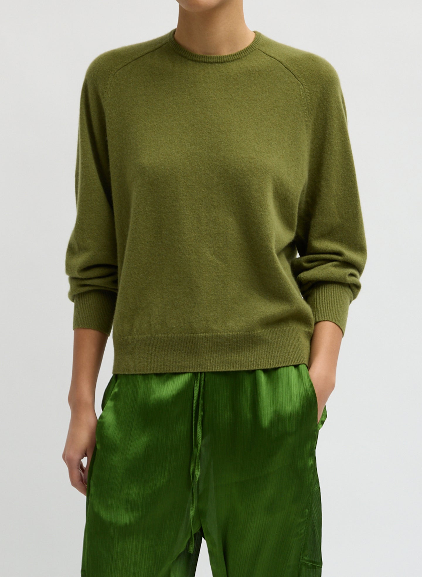 Green Feather Weight Cashmere Sweater - thin crewneck sweater, front view on model