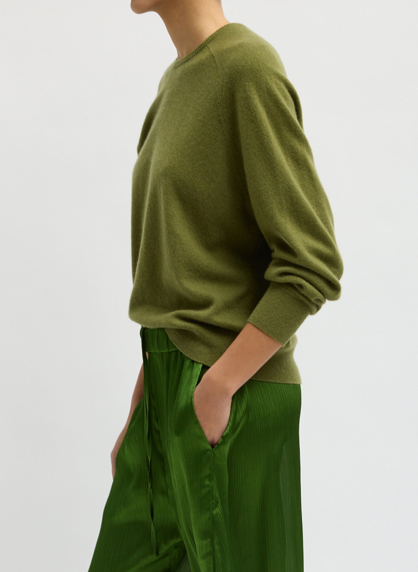 Green Feather Weight Cashmere Sweater - thin crewneck sweater, side view on model
