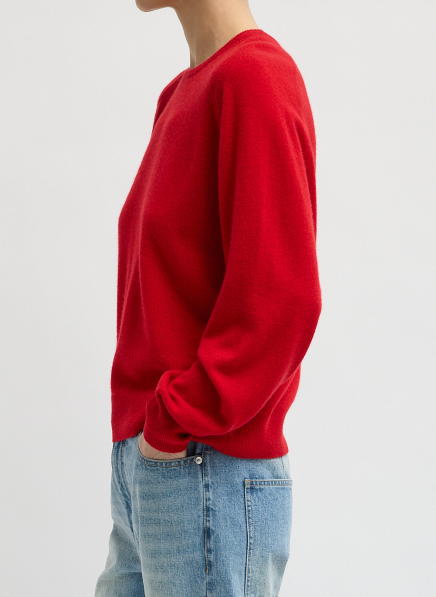Red Feather Weight Cashmere Sweater - thin crewneck sweater, side view on model