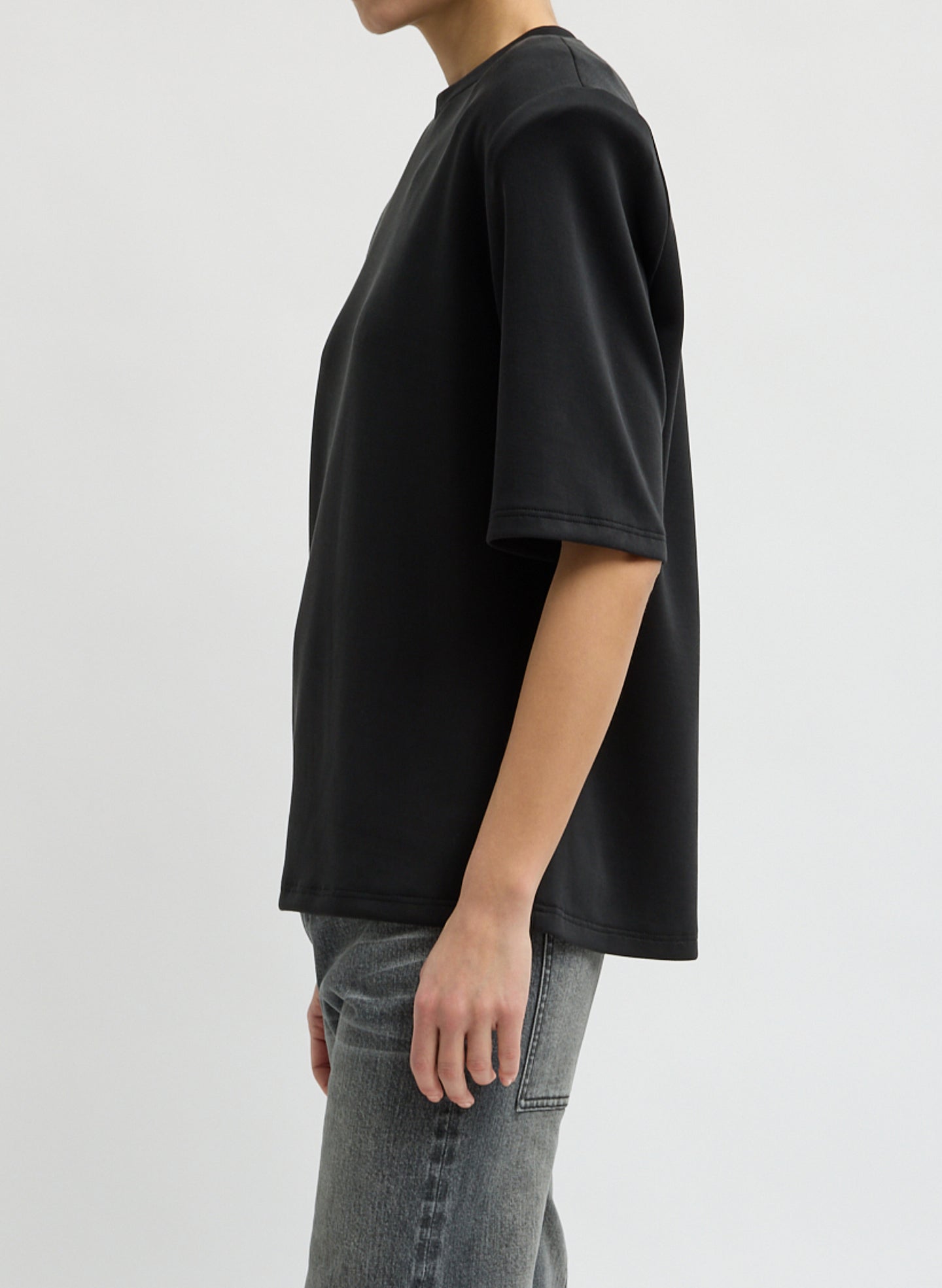 Black Feather Weight Viscose Neoprene Removable Shoulder Pad Top - short sleeve t-shirt, side view on model