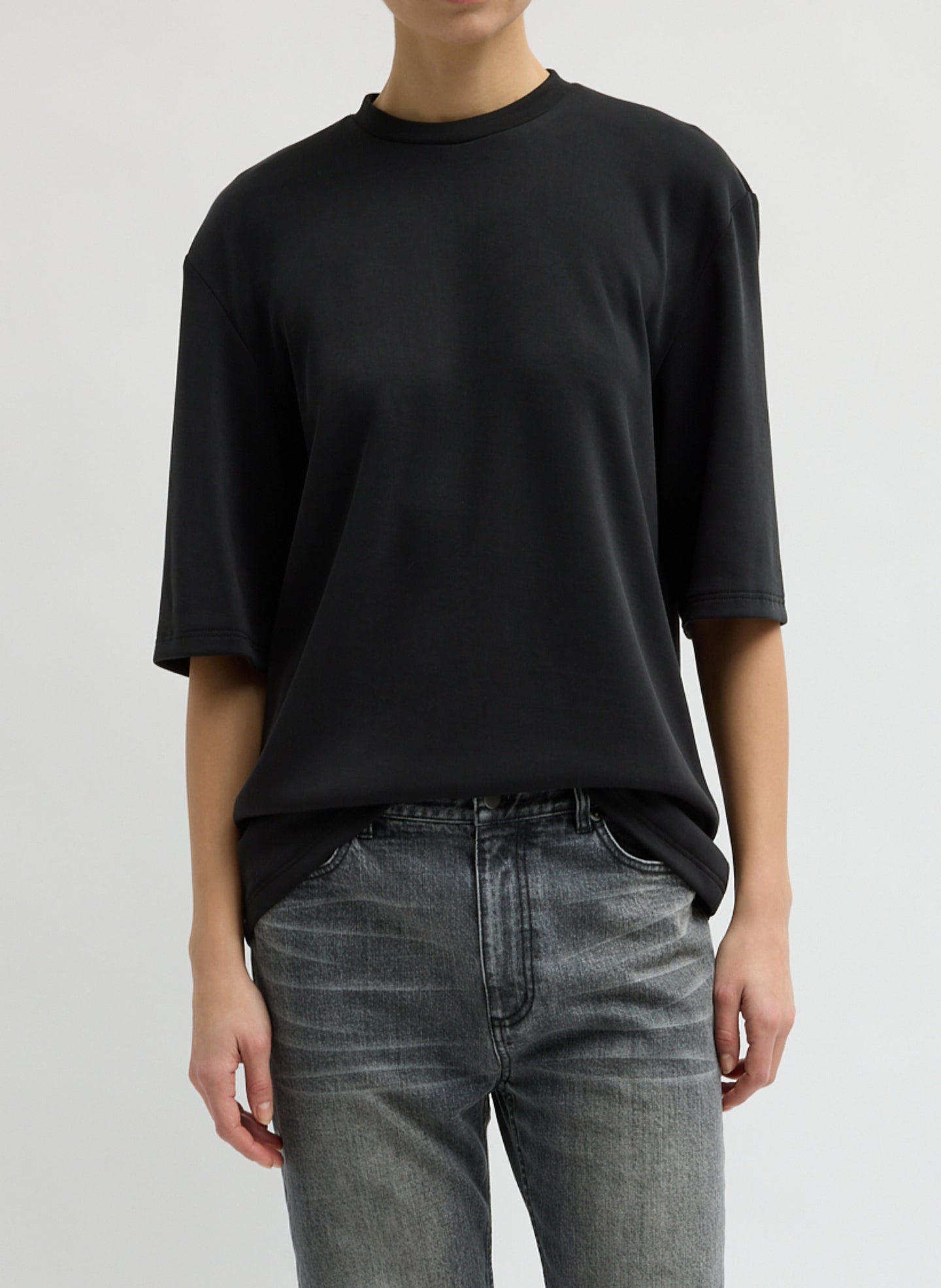 Black Feather Weight Viscose Neoprene Removable Shoulder Pad Top - short sleeve t-shirt, front view on model