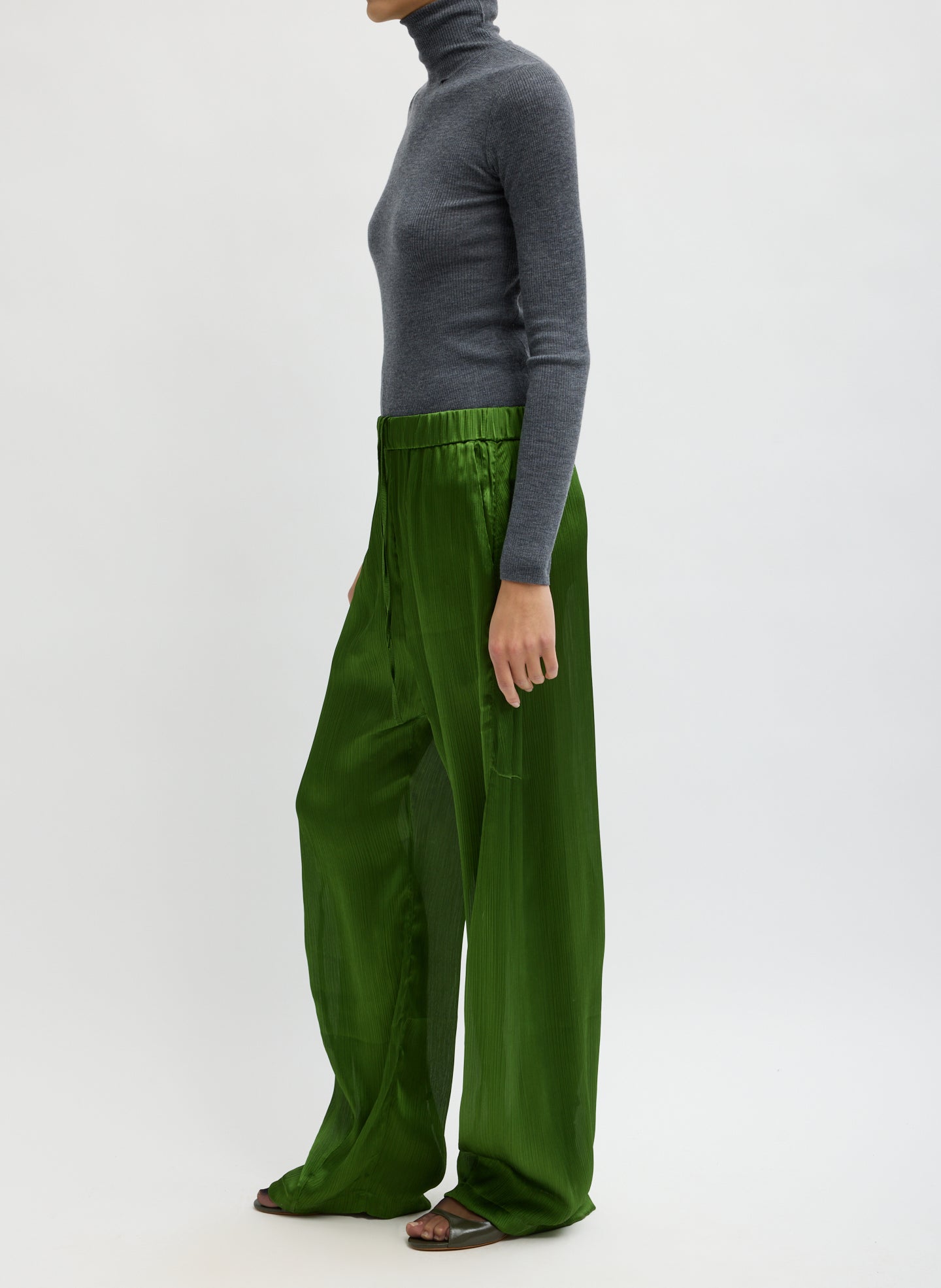 Green Matte Satin Plisse Winslow Pant - barrel leg satin pant, side view on model
