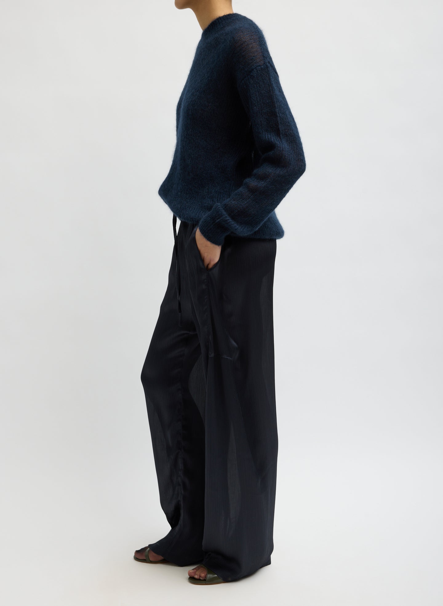 Navy Matte Satin Plisse Winslow Pant - barrel leg satin pant, side view on model