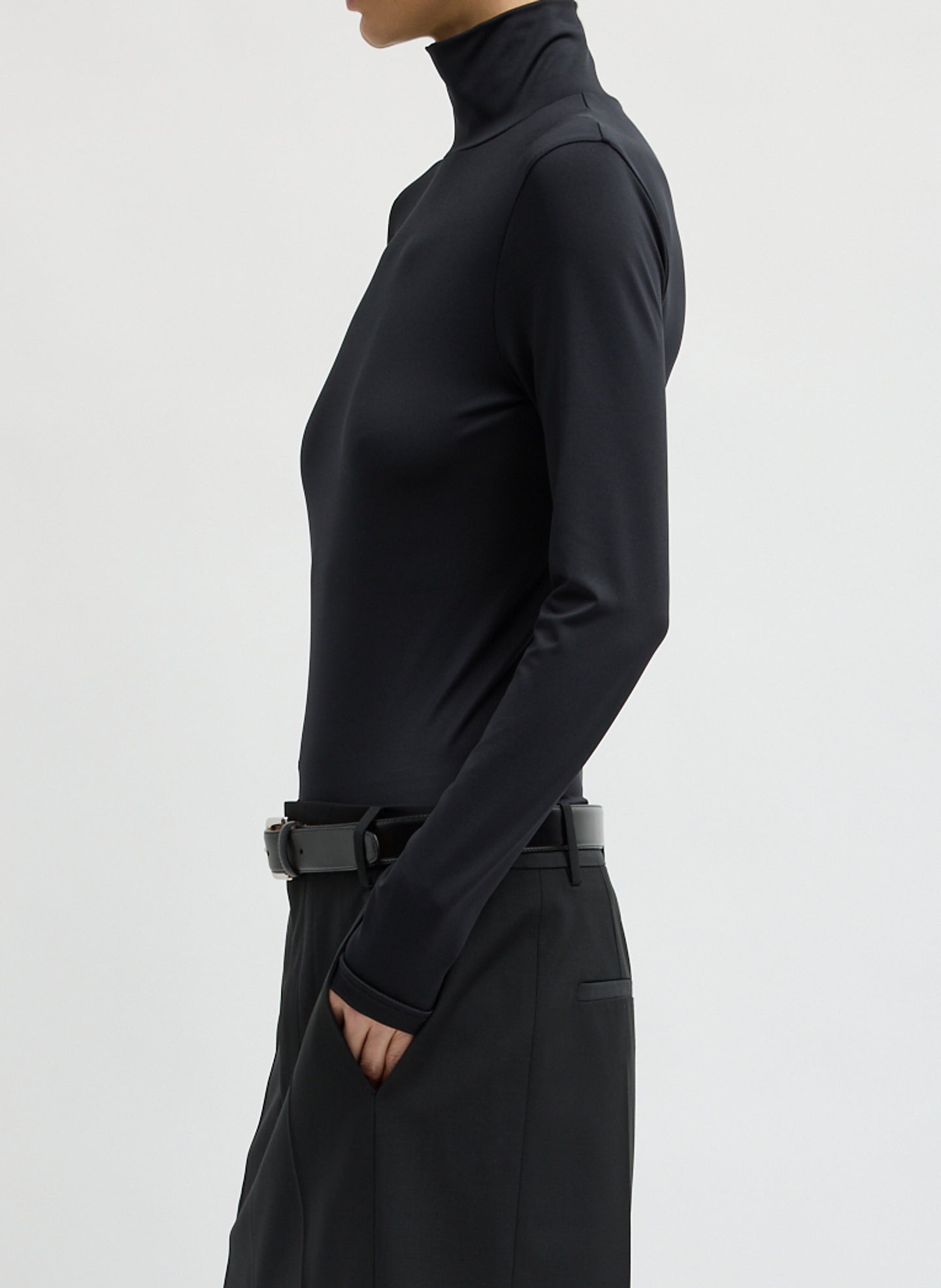 Black Stretch Light Weight Tech Knit Turtleneck - side view on model
