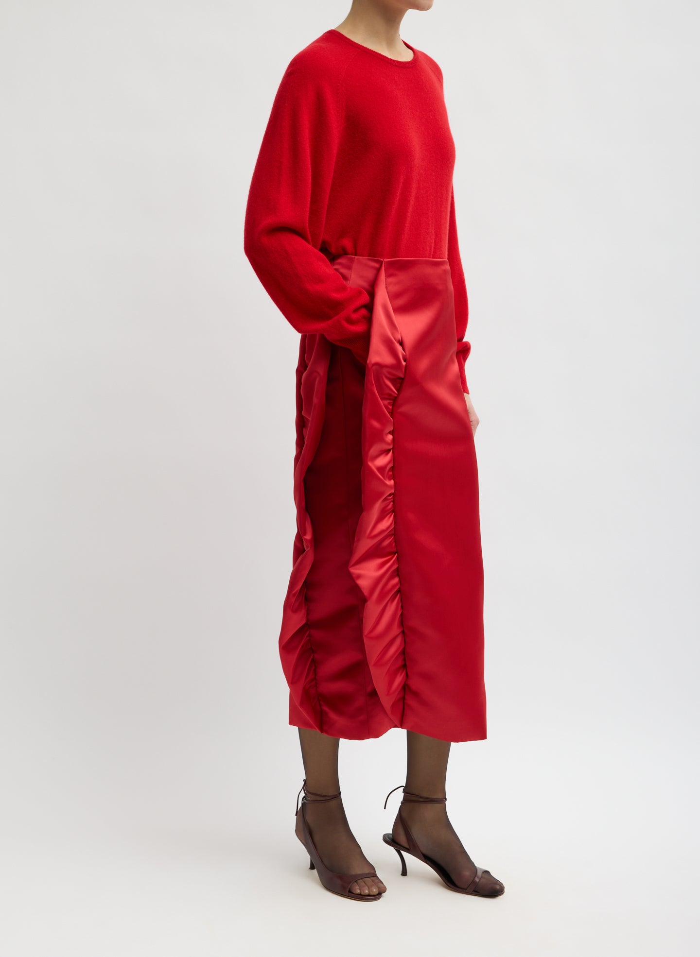 Red Tech Satin Side Ruffle Skirt - midi skirt, side view on model