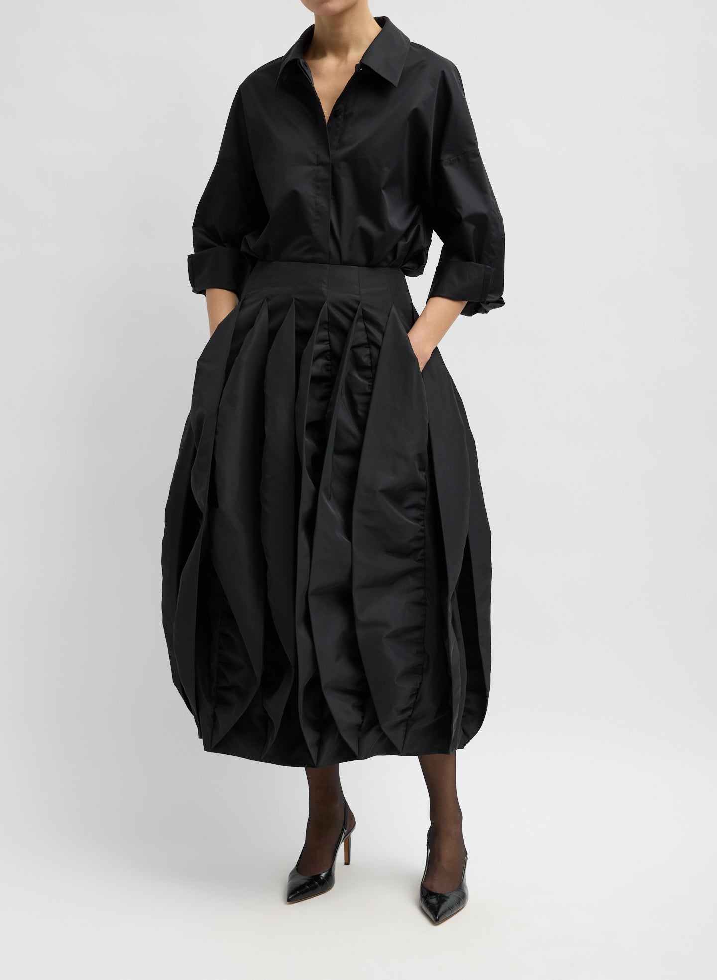 Black Recycled Italian Sporty Nylon Skirt - pleated bubble midi skirt, front view on model