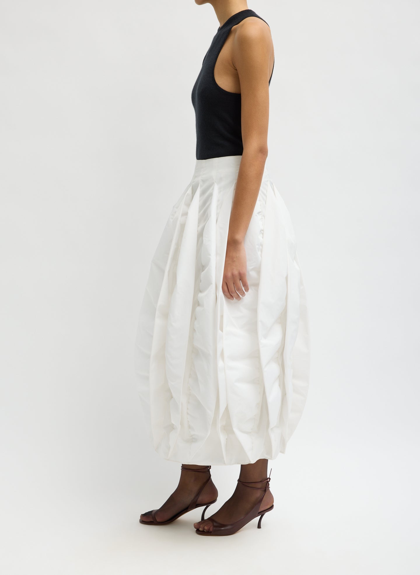 White Recycled Italian Sporty Nylon Skirt - pleated bubble midi skirt, side view on model