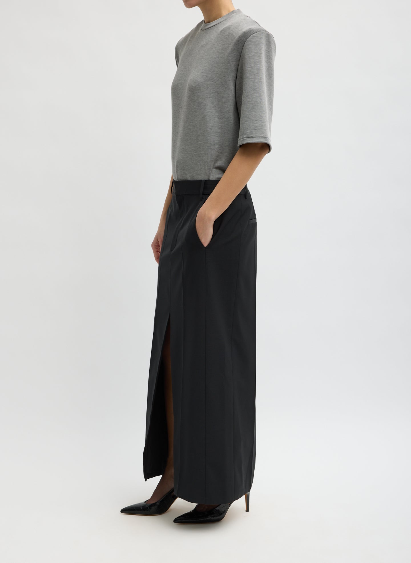 Black Recycled Tropical Wool Double Slit Maxi Skirt - maxi trouser skirt with front slit, side view on model