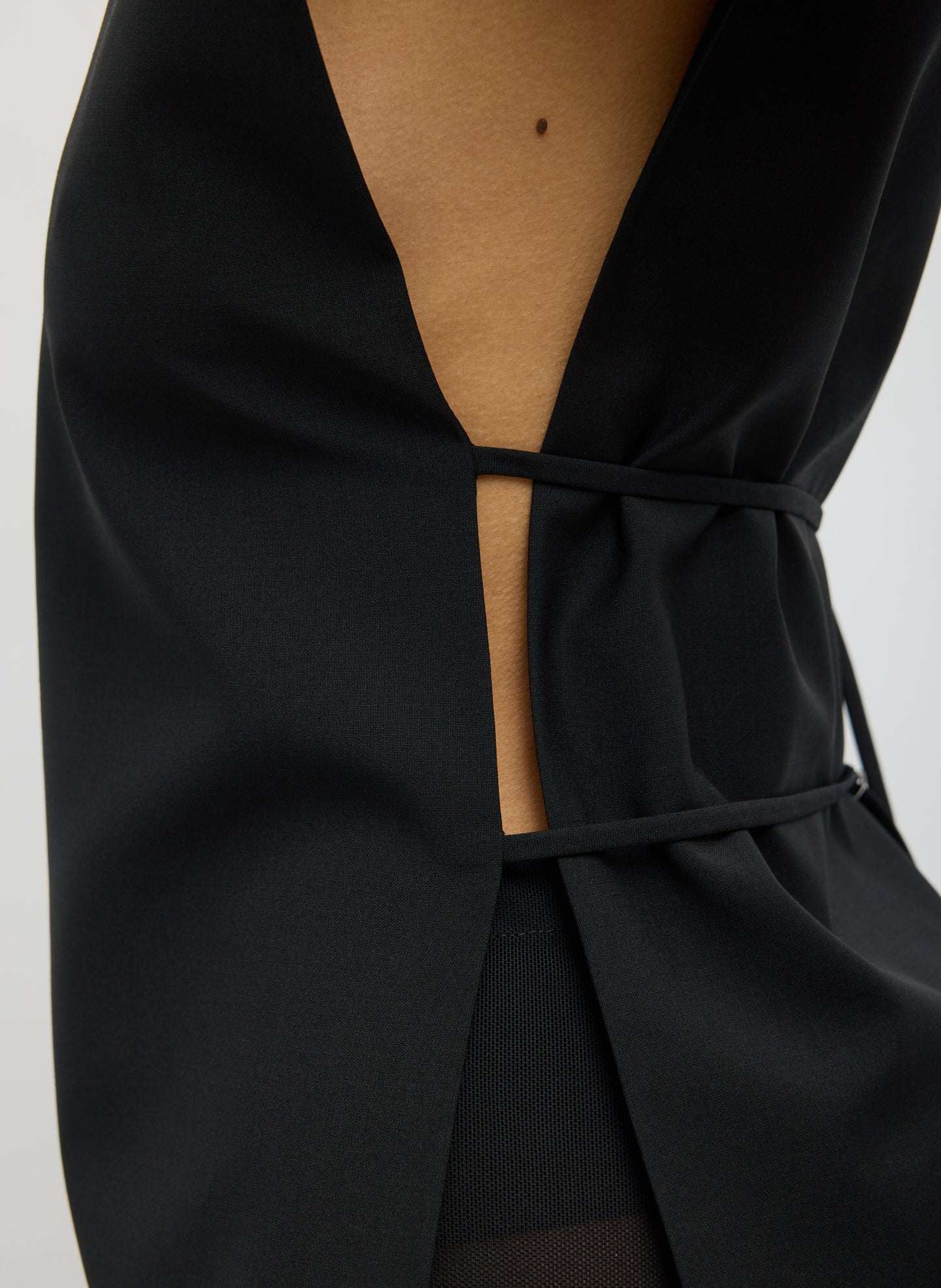 Black Recycled Tropical Wool Bib Top - closeup of side tie detail
