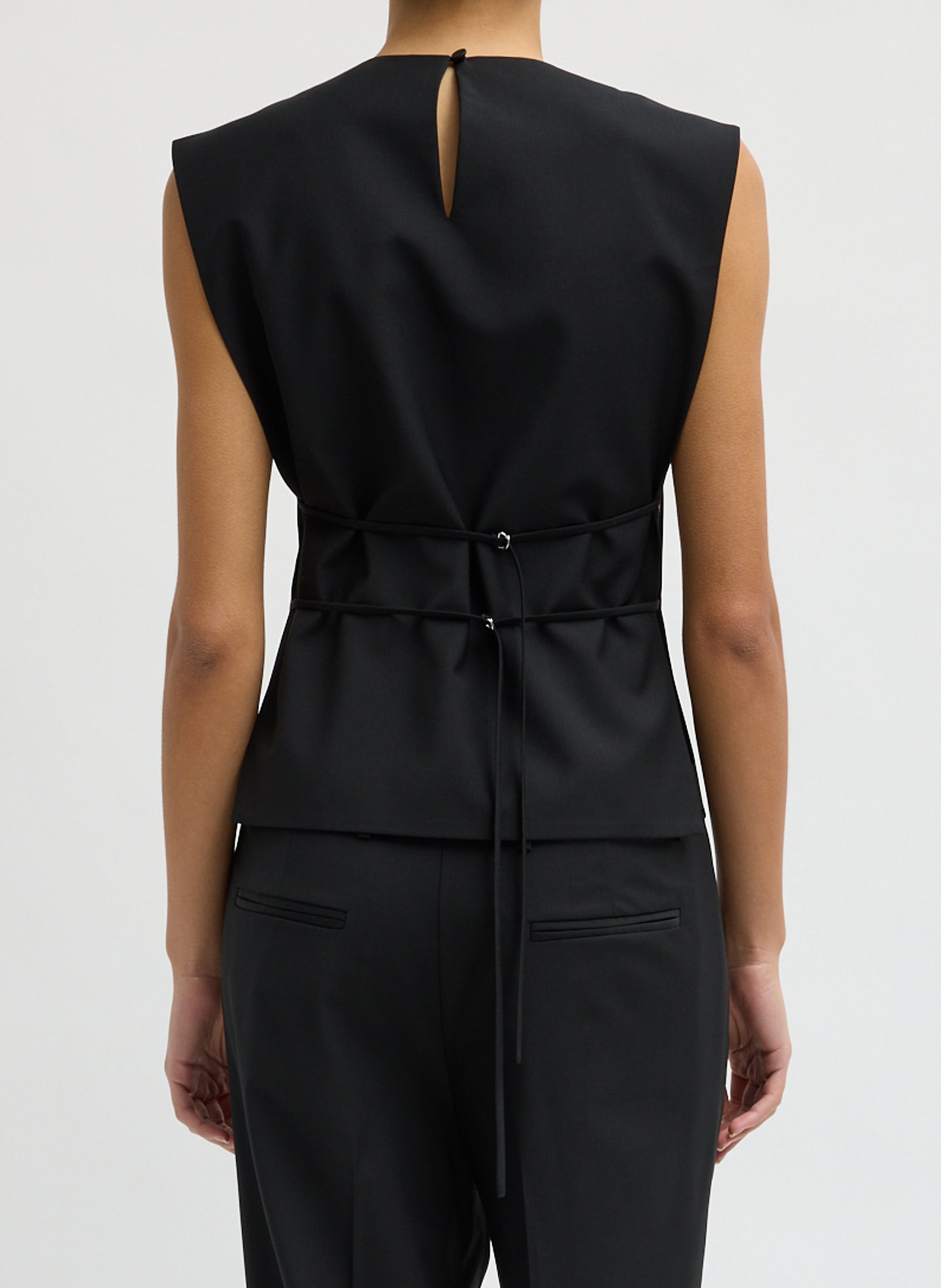 Black Recycled Tropical Wool Bib Top - sleeveless top, back view on model