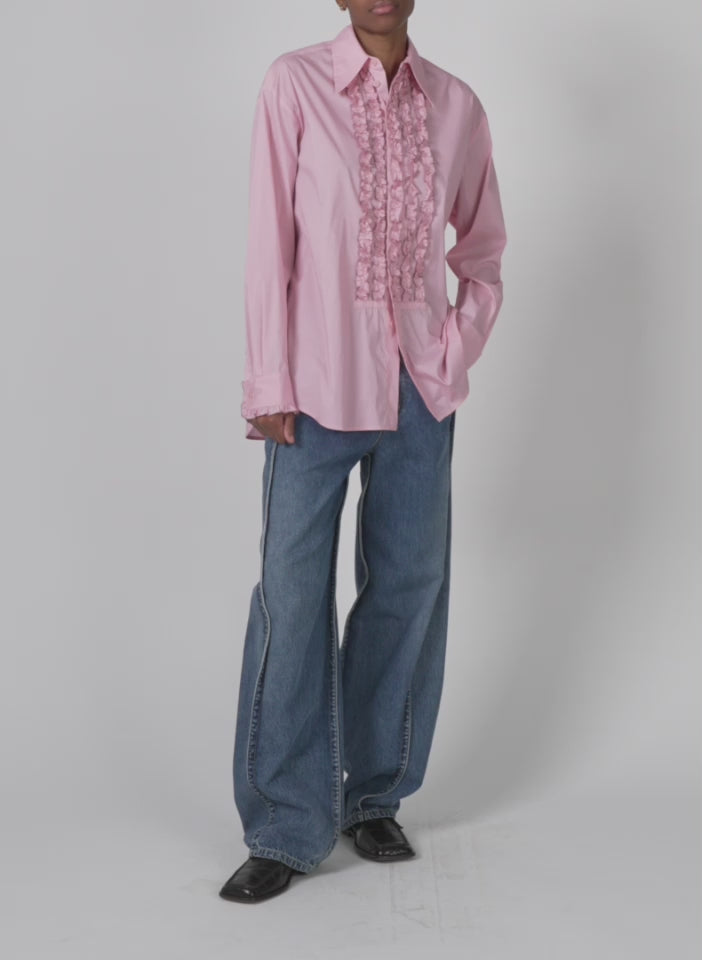 Model wearing the light weight cotton nylon easy tuxedo shirt pink walking forward and turning around