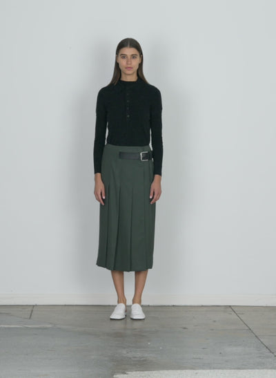 Model wearing the grain de poudre wide pleat wrap skirt grey pine walking forward and turning around