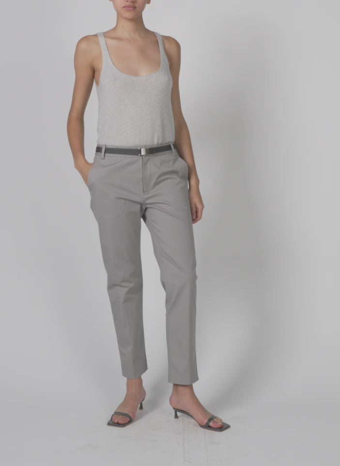 Model wearing the oliver cotton stretch tricotine lennon ankle pant grey moon walking forward and turning around