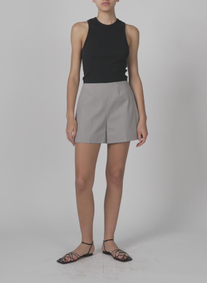 Model wearing the oliver cotton stretch tricotine structured shorts grey moon walking forward and turning around