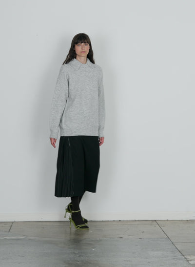 Model wearing the douillet crewneck easy pullover light heather grey walking forward and turning around