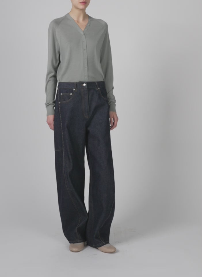 Model wearing the cashmere silk blend slim cardigan pumice grey walking forward and turning around