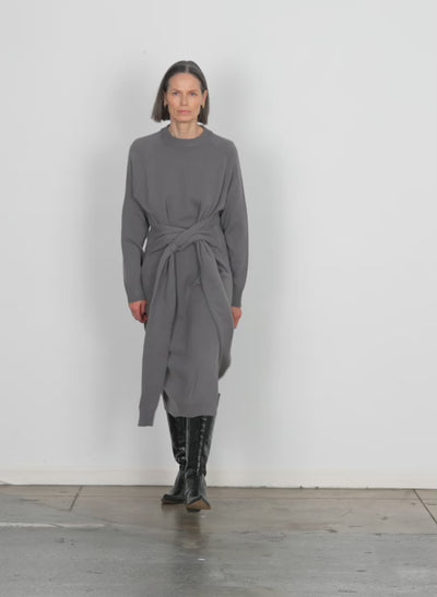 Model wearing the airy extrafine wool blair dress grey walking forward and turning around