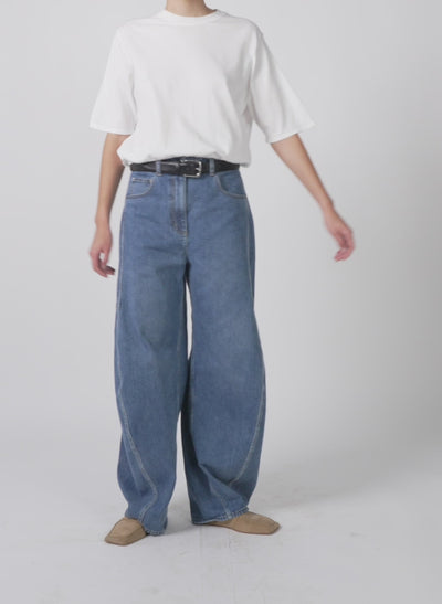 Model wearing the superfine gauge perfect short sleeve men's pullover white walking forward and turning around