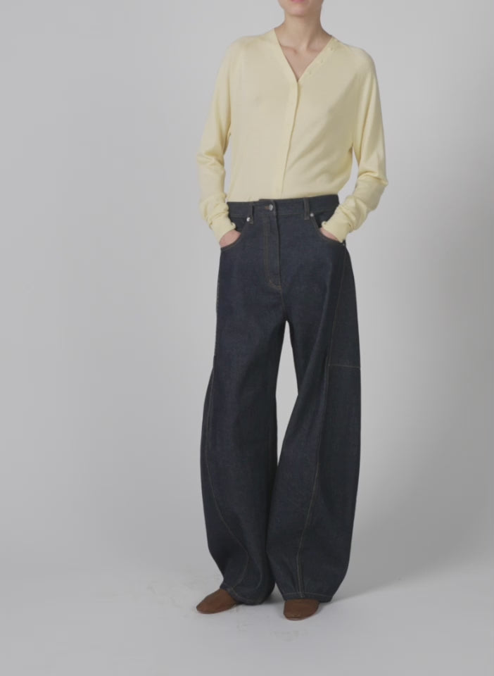 Model wearing the cashmere silk blend slim cardigan lemon ice walking forward and turning around