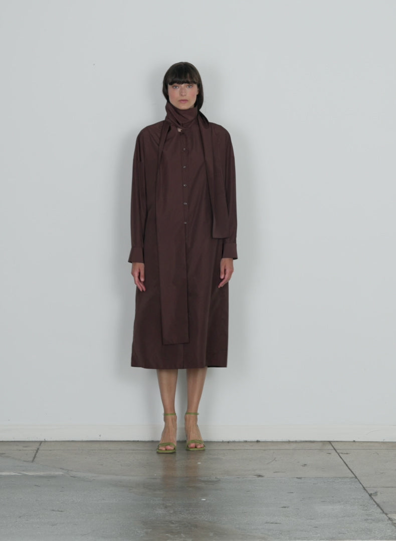 Model wearing the italian sporty nylon davenport shirtdress dark brown walking forward and turning around