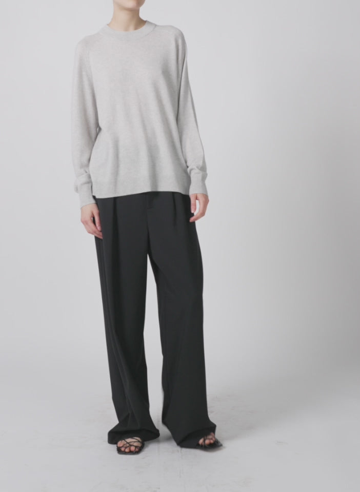 Model wearing the washable crewneck sweatshirt sweater light heather grey walking forward and turning around
