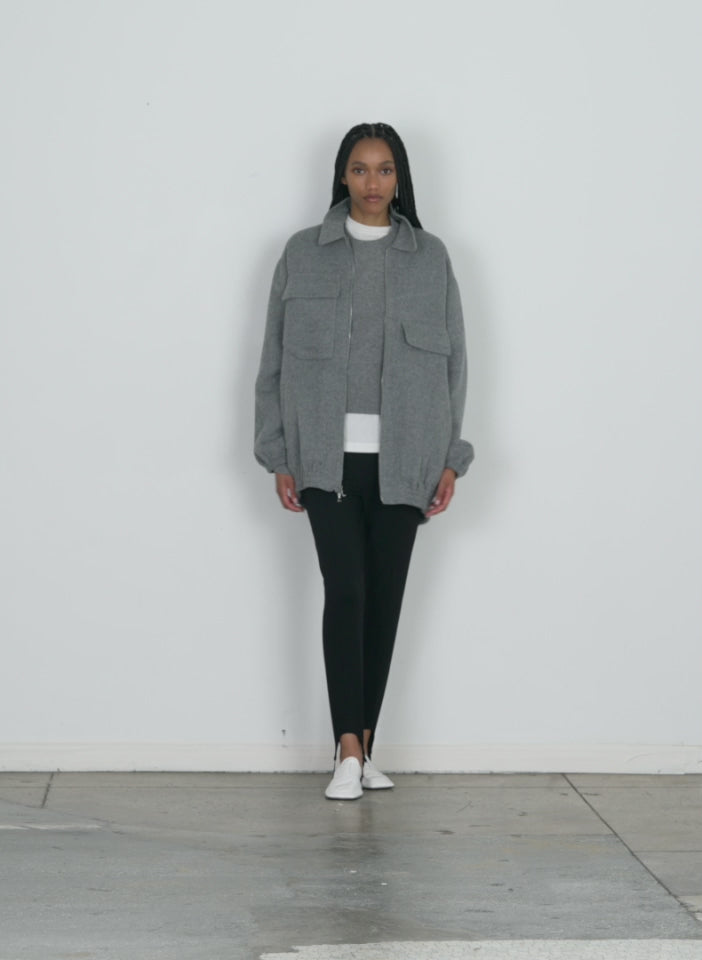 Model wearing the luxe wool angora oversized bomber medium heather walking forward and turning around