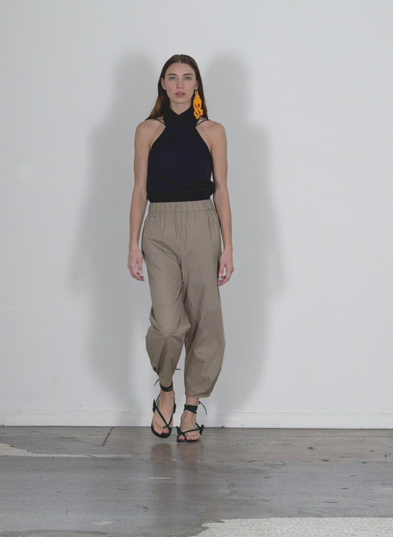 Model wearing the vintage cotton pullon sculpted jogger serene blue walking forward and turning around