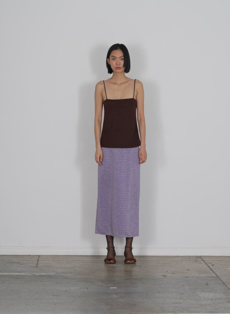 Model wearing the lurex haze pencil skirt lavender multi walking forward and turning around