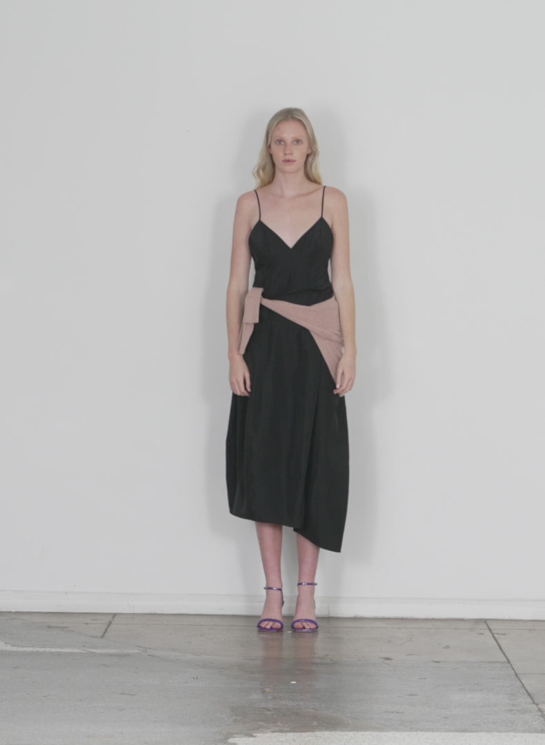 Model wearing the italian sporty nylon cami dress black walking forward and turning around