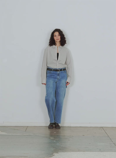 Model wearing the classic denim sam jean walking forward and turning around