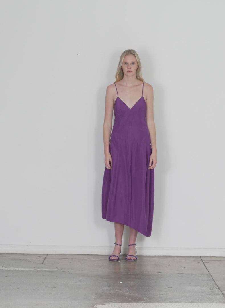 Model wearing the italian sporty nylon cami dress purple walking forward and turning around