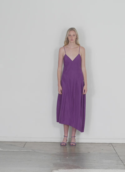 Model wearing the italian sporty nylon cami dress purple walking forward and turning around