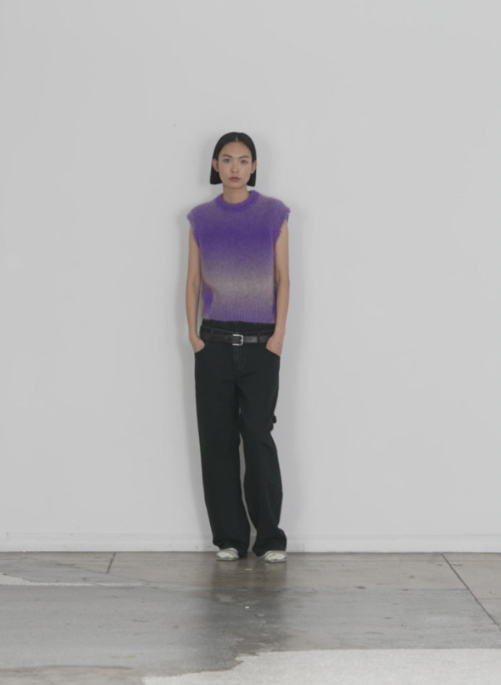 Model wearing the ombre superfine alpaca shrunken cutoff vest purple multi walking forward and turning around