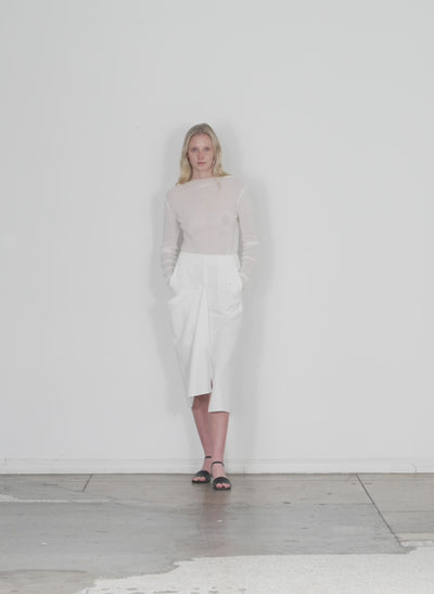 Model wearing the lancaster lyocell draped skirt ivory walking forward and turning around