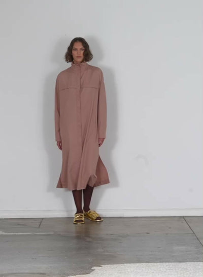 Model wearing the italian sporty nylon shirtdress toffee walking forward and turning around