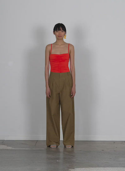 Model wearing the cotton nylon stella pant walking forward and turning around