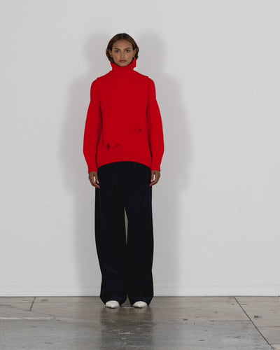 Model wearing the airy extrafine wool turtleneck dicky sweater walking forward and turning around