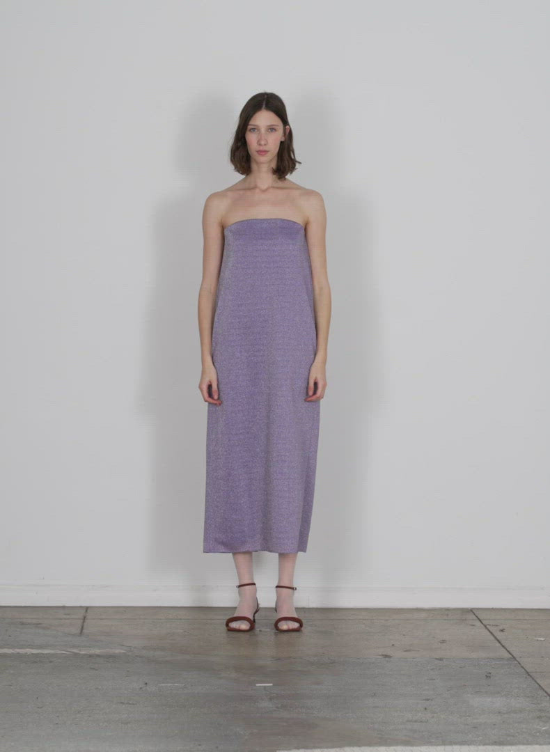 Model wearing the lurex haze strapless dress lavender multi walking forward and turning around