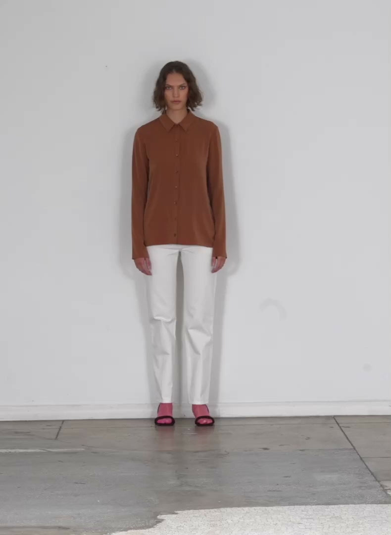 Model wearing the soft drape slim shirt cocoa brown walking forward and turning around
