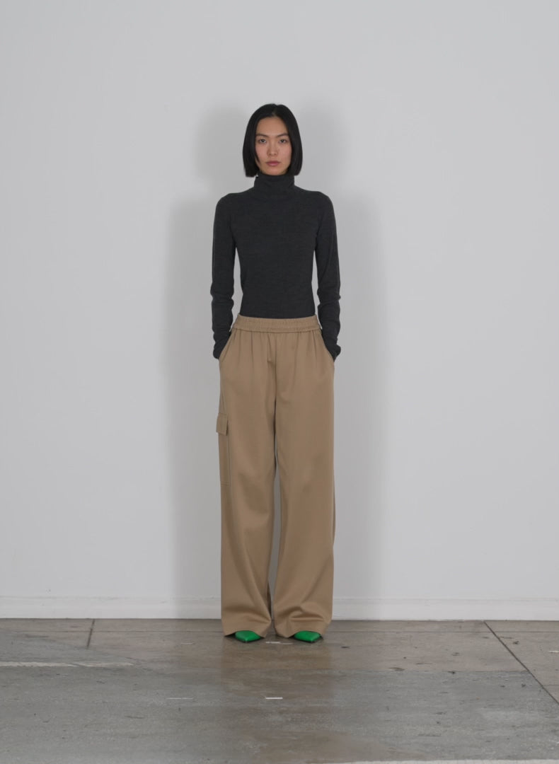 Model wearing the active knit wide leg pullon pant tan walking forward and turning around
